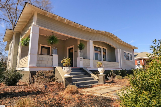 view of front of house featuring a porch and stairway