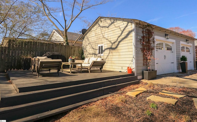 view of side of property featuring an outdoor structure, fence, a wooden deck, and an outdoor hangout area