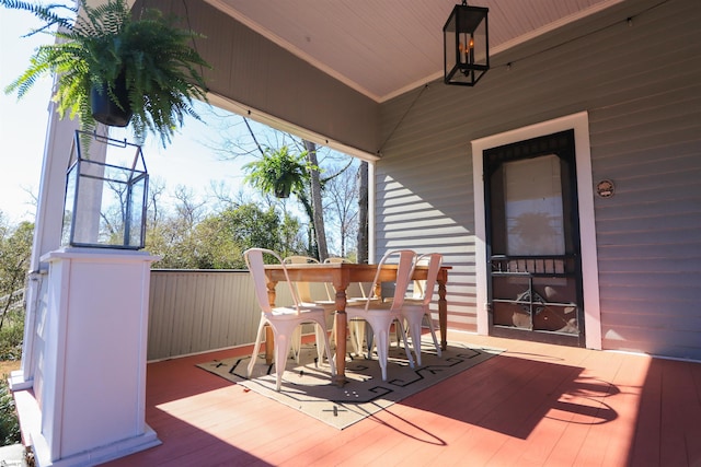 wooden deck with outdoor dining space