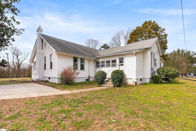 view of front of house with entry steps, crawl space, and a chimney