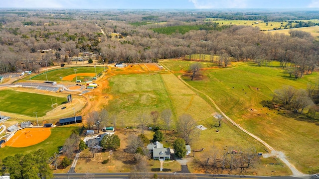 aerial view with a rural view and a wooded view