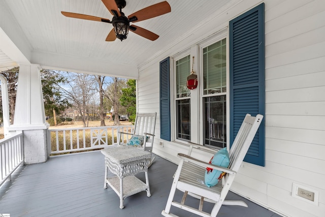 deck with covered porch and ceiling fan