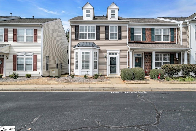 view of front of home featuring brick siding