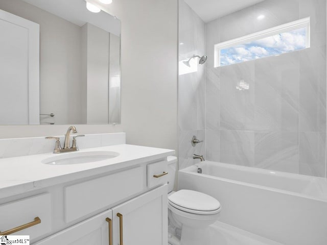 full bath featuring shower / bathing tub combination, vanity, and toilet