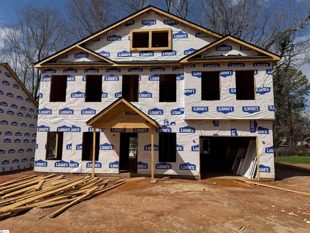 property under construction featuring an attached garage