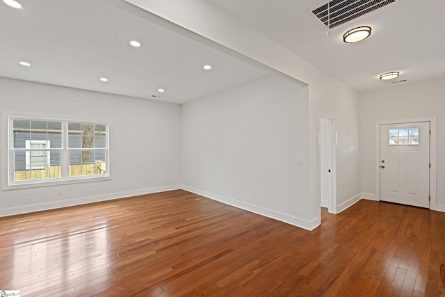 entryway featuring hardwood / wood-style floors, recessed lighting, visible vents, and a healthy amount of sunlight