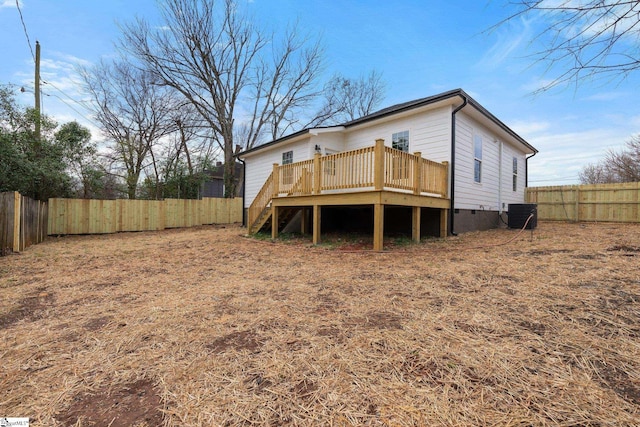 rear view of house with central air condition unit, crawl space, a fenced backyard, a wooden deck, and stairs