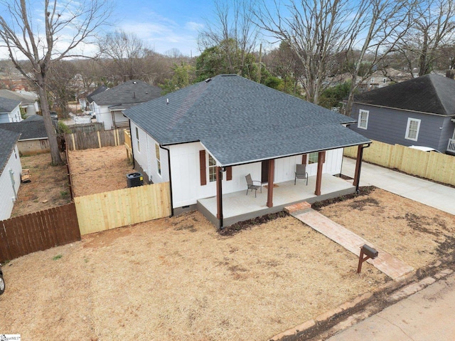 single story home featuring crawl space, fence private yard, a patio, and roof with shingles