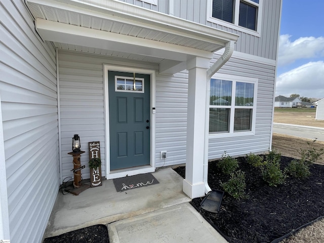 property entrance featuring board and batten siding