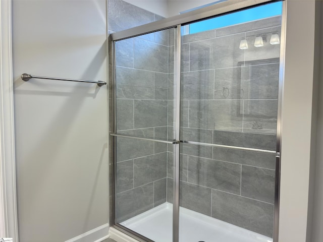 full bath featuring tiled shower