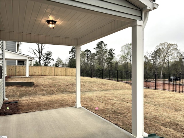 exterior space with a patio area and a fenced backyard