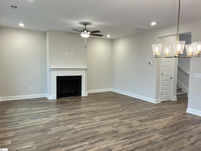 unfurnished living room with recessed lighting, visible vents, and ceiling fan with notable chandelier