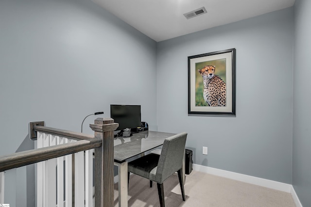 office area featuring baseboards, visible vents, and carpet flooring