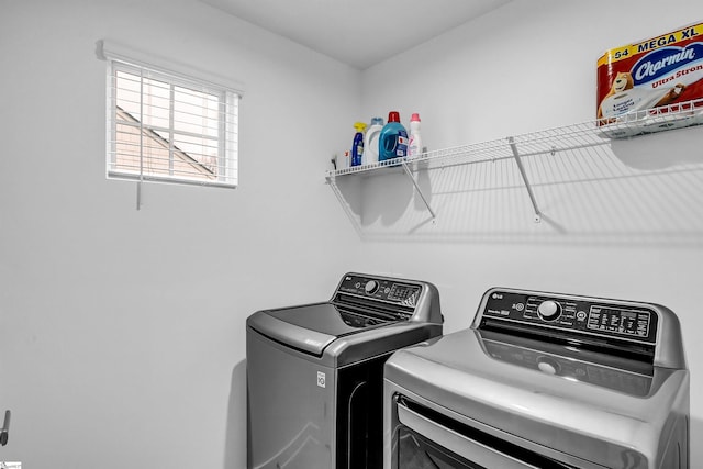 washroom with laundry area and washing machine and dryer