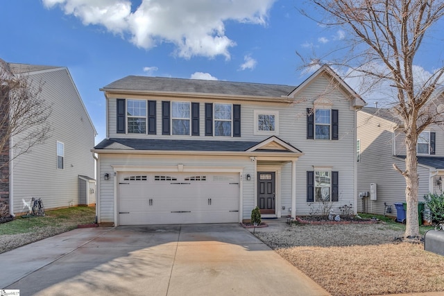 view of front of house with concrete driveway and an attached garage