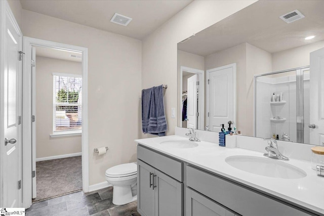 full bathroom featuring a stall shower, visible vents, and a sink