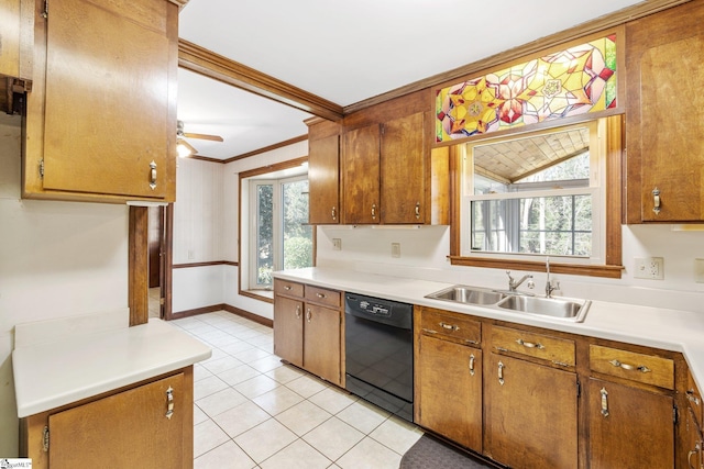 kitchen featuring crown molding, black dishwasher, light countertops, and a sink