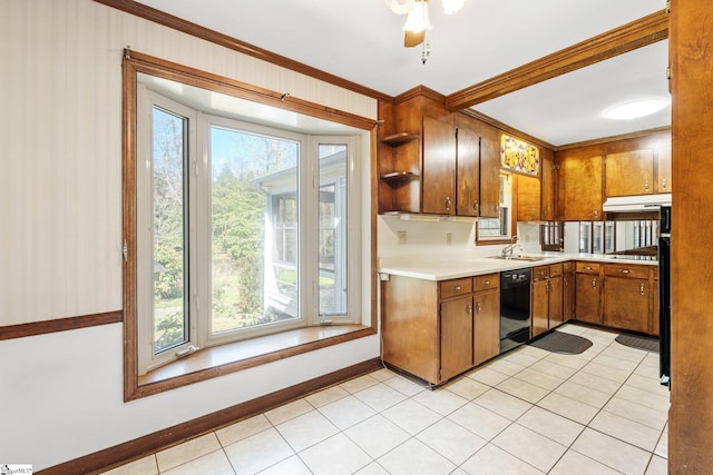 kitchen featuring black dishwasher, stainless steel gas cooktop, light countertops, brown cabinetry, and under cabinet range hood