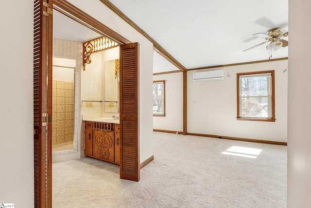 spare room with plenty of natural light, ornamental molding, light colored carpet, and a wall mounted AC