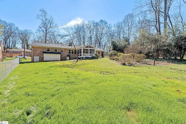 exterior space featuring a sunroom and fence