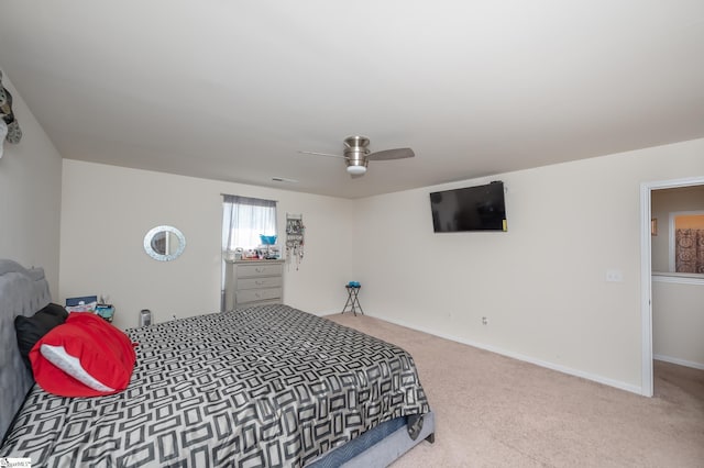 bedroom with carpet flooring, ceiling fan, visible vents, and baseboards