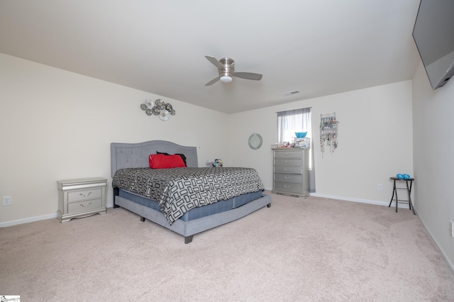 bedroom with baseboards, carpet, visible vents, and a ceiling fan