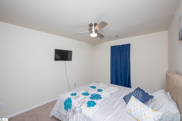 bedroom featuring ceiling fan, carpet, visible vents, and baseboards