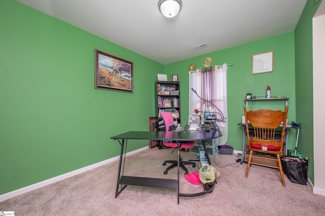 carpeted office with visible vents and baseboards