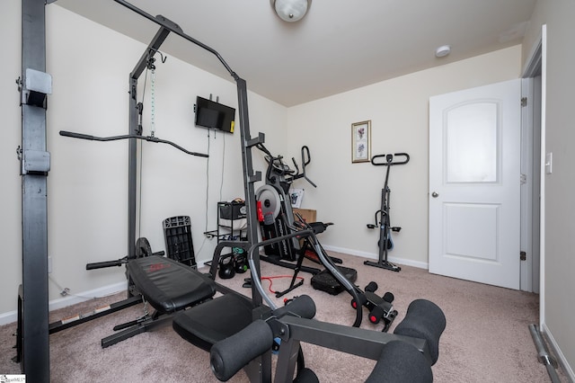 exercise area with carpet floors and baseboards