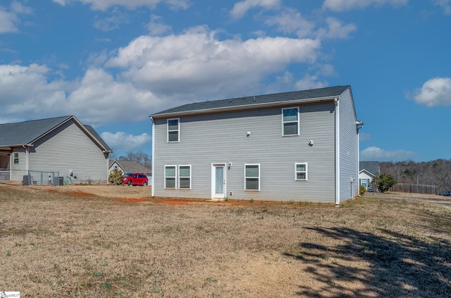 back of house with a yard