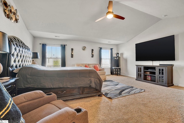 bedroom with a ceiling fan, carpet, lofted ceiling, and baseboards