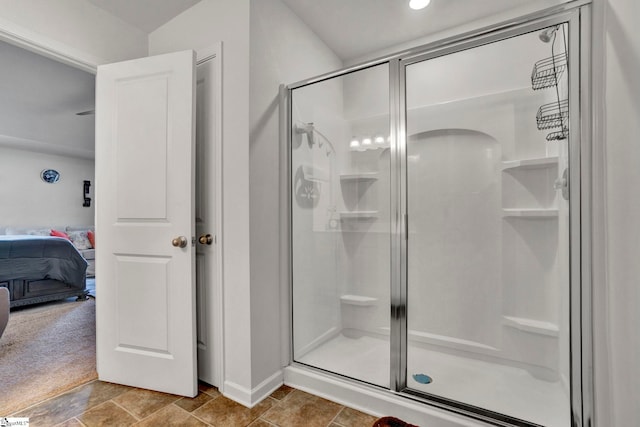 full bathroom with ensuite bathroom and a shower stall