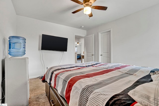 bedroom featuring carpet floors, a ceiling fan, and baseboards