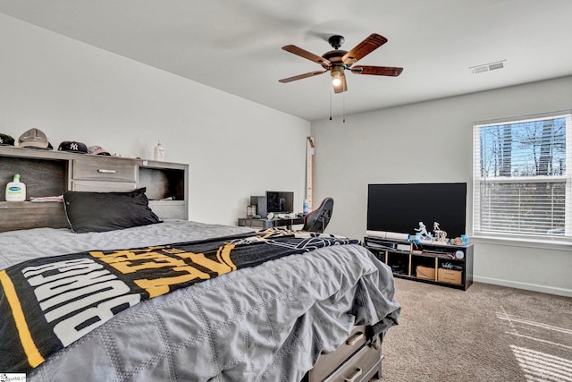 bedroom with carpet floors, baseboards, visible vents, and ceiling fan