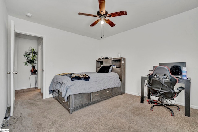 carpeted bedroom with baseboards and a ceiling fan