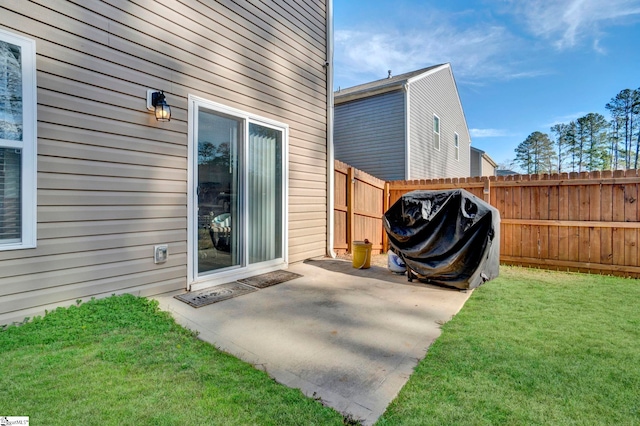 view of patio / terrace featuring area for grilling and fence