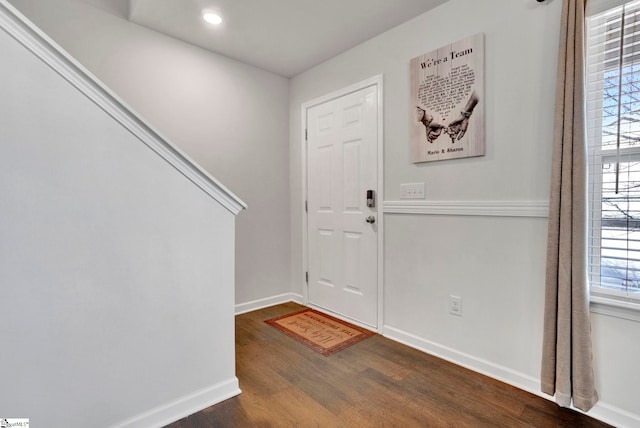 entrance foyer with baseboards and dark wood-style flooring