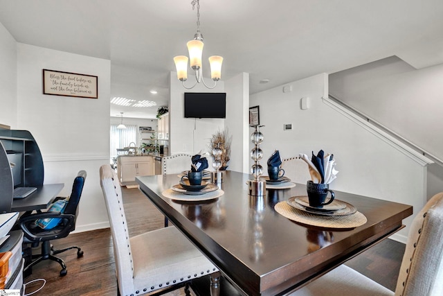 dining area featuring dark wood finished floors and baseboards