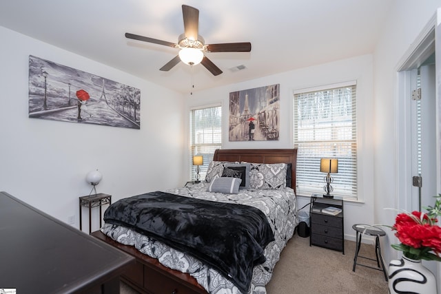 bedroom with ceiling fan, carpet flooring, and visible vents