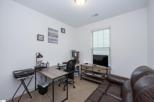 home office with visible vents and carpet flooring