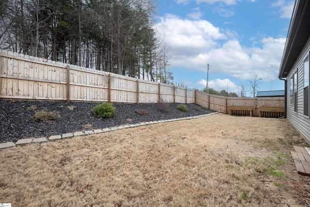 view of yard with a fenced backyard