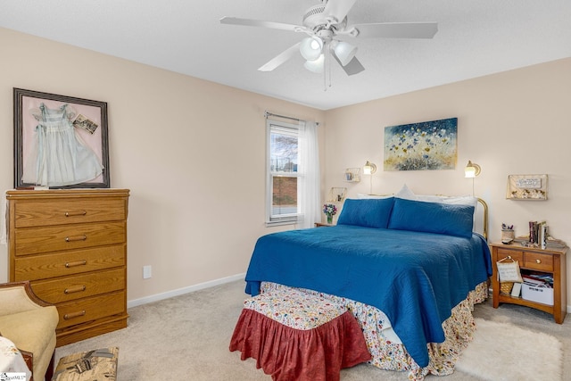 bedroom with ceiling fan, baseboards, and carpet flooring