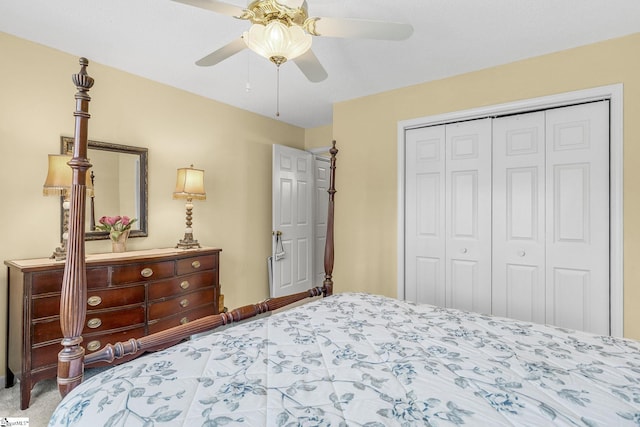 carpeted bedroom with ceiling fan and a closet