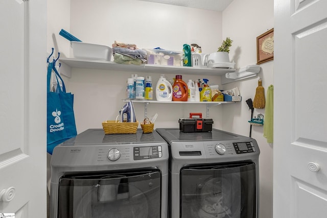 clothes washing area with laundry area and separate washer and dryer