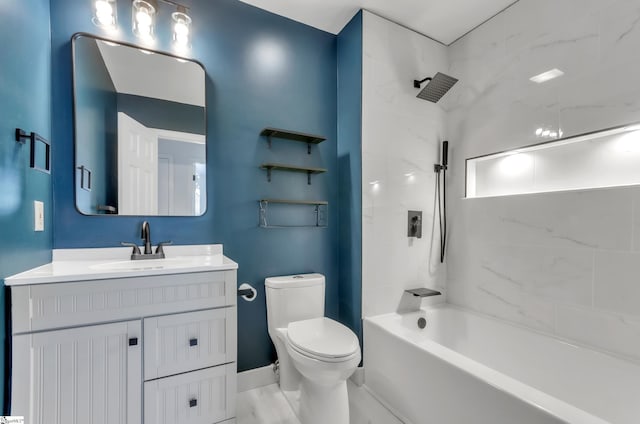 bathroom featuring marble finish floor, shower / washtub combination, vanity, and toilet