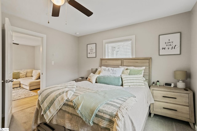 bedroom with wood finished floors and a ceiling fan