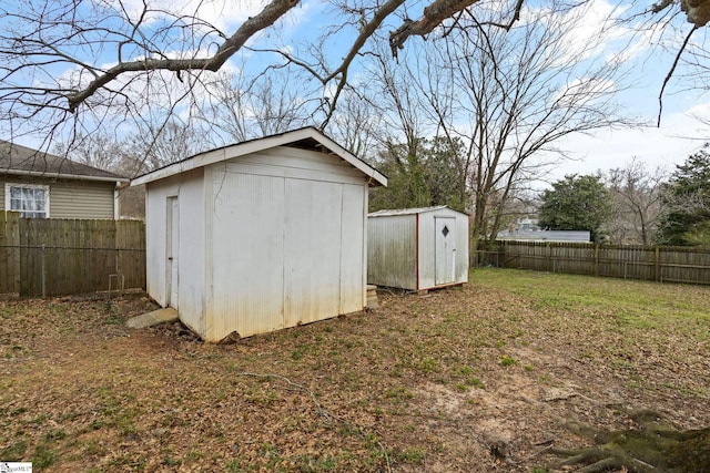 view of shed with a fenced backyard