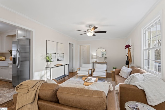 living room featuring crown molding and wood finished floors