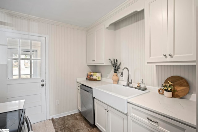 kitchen with baseboards, white cabinets, a sink, and stainless steel dishwasher