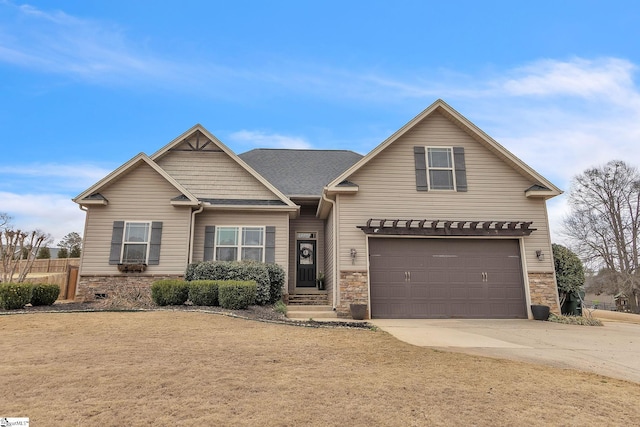 view of front of property with a garage, stone siding, concrete driveway, and roof with shingles